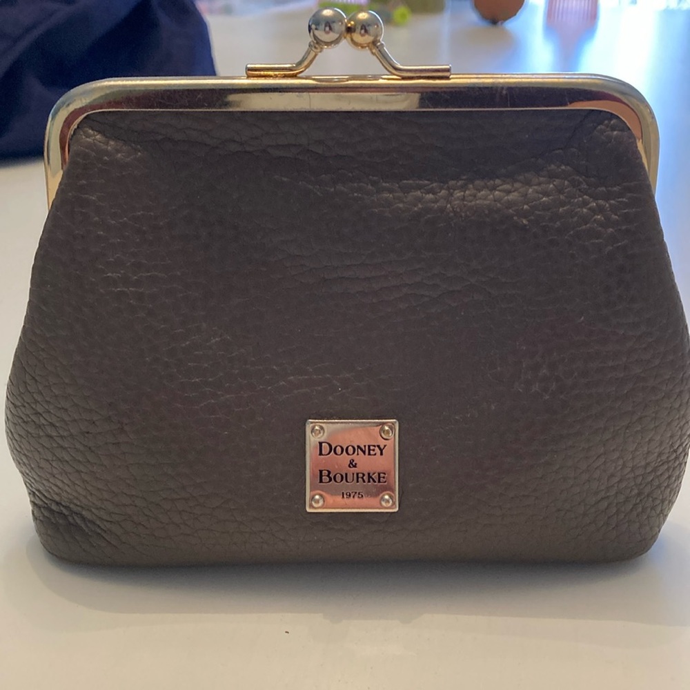 Used Dooney & Bourke Pebble Grain Large Framed coin purse.
